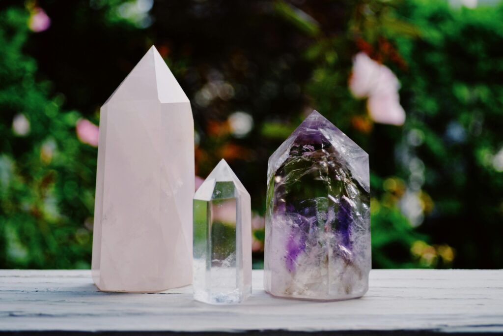 pexels-photo-1573236-1573236 A beautiful arrangement of crystals including amethyst and quartz displayed outdoors.