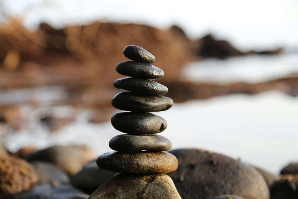pexels-photo-355863-355863 A stack of smooth stones artfully balanced by a waterside, evoking tranquility and zen.